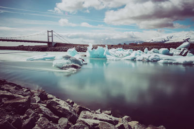 Aerial view of bridge against sky during winter