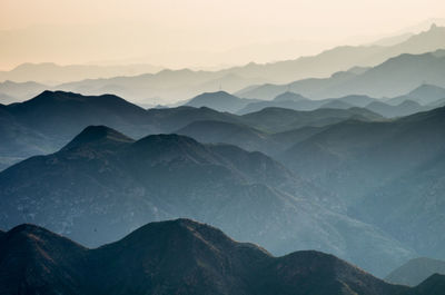 Low angle view of silhouette mountains against clear sky