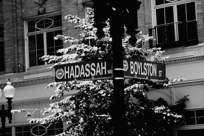 Low angle view of information sign in city