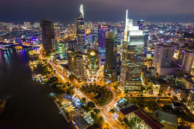 High angle view of illuminated city buildings at night