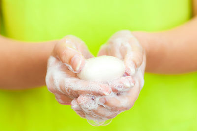 Close-up of hand holding ice cream