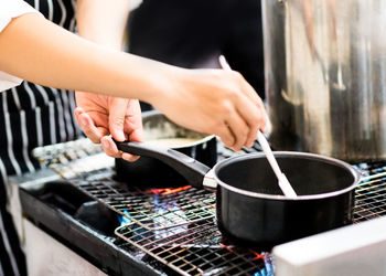 Midsection of woman preparing food