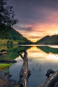 Scenic view of lake against sky during sunset