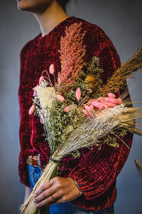 Close-up of woman holding bouquet