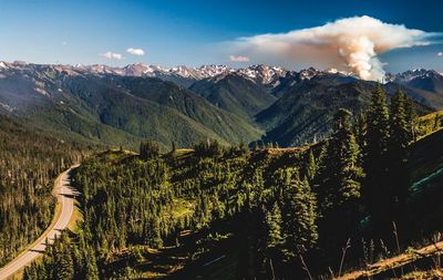 Scenic view of green mountains against sky