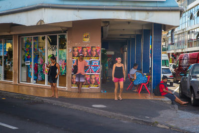 People walking on street in city