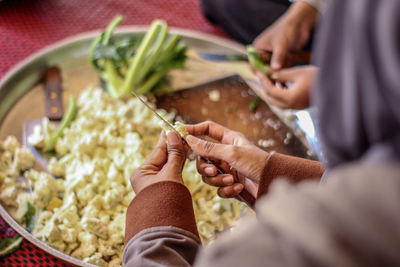 Midsection of woman preparing food