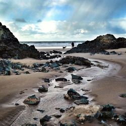 Scenic view of sea against cloudy sky