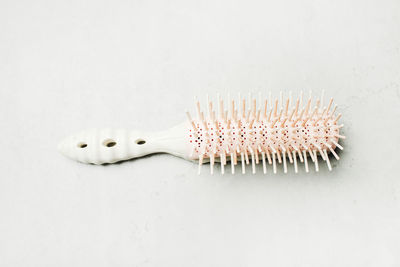High angle view of fork on table against white background