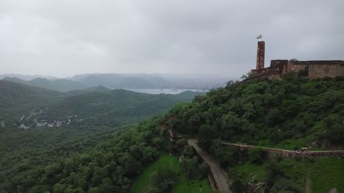 Fort by landscape against sky