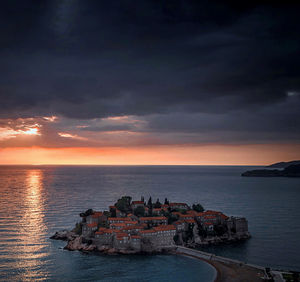 Scenic view of sea against sky at sunset