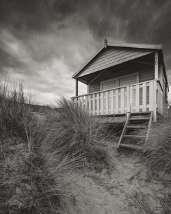 Built structure on landscape against sky