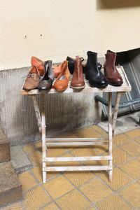 High angle view of shoes on floor against wall