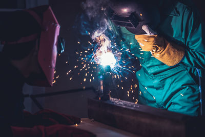 People working in illuminated room