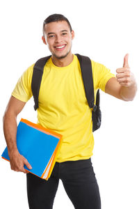 Portrait of young man standing against white background