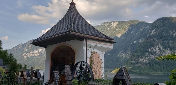 Panoramic view of building and mountains against sky