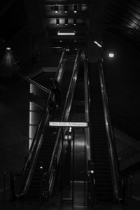 Low angle view of escalator in illuminated building