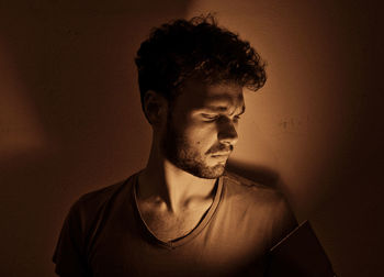 Close-up portrait of young man against white background