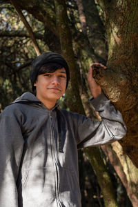 Portrait of young man in forest