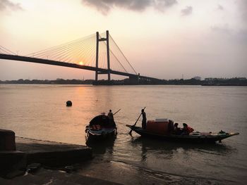 View of suspension bridge over sea