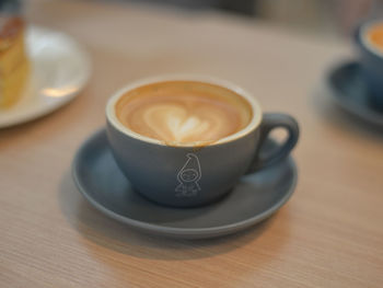 Close-up of cappuccino served on table