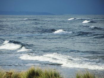 Scenic view of sea against clear sky