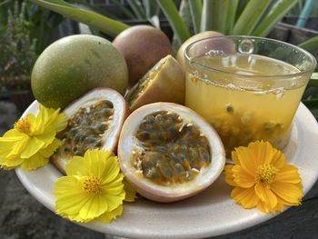 Close-up of fresh fruits in glass with water on table