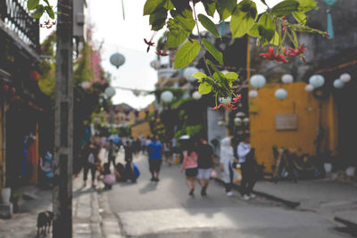 People walking on street in city