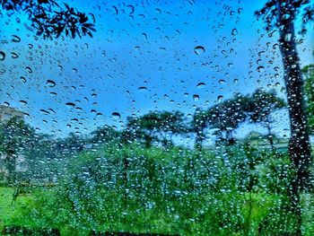 Full frame shot of wet glass window in rainy season