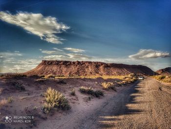 Road by land against sky