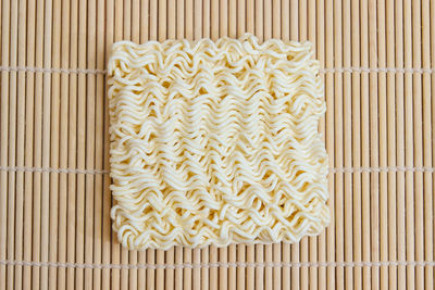 High angle view of noodles on wood