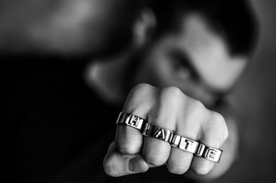 Close-up of human hand holding text