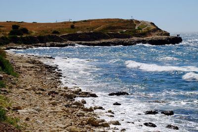 Scenic view of sea against blue sky