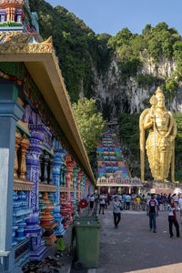 Statue outside temple against building