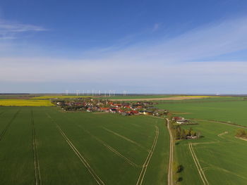 Scenic view of agricultural field against sky