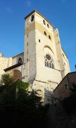 Low angle view of built structure against clear blue sky