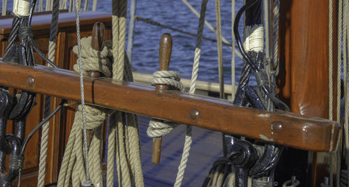 Close-up of sailboats tied on rope