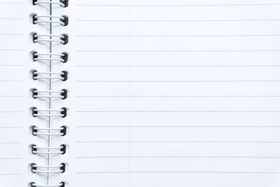 Full frame shot of open blank spiral notebook
