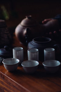 Close-up of illuminated candles on table