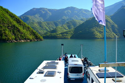 Lake koman is a reservoir on the drin river in northern albania, surrounded by dense forested hills,