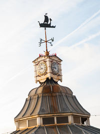 Low angle view of clock tower against sky