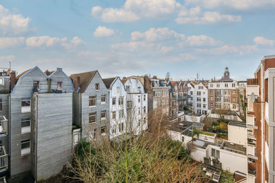 Buildings in city against sky