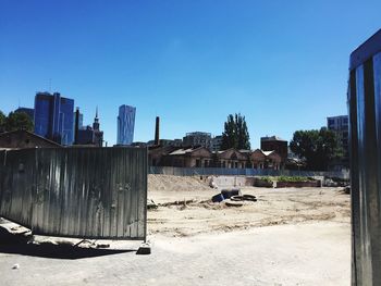 Built structures against clear blue sky