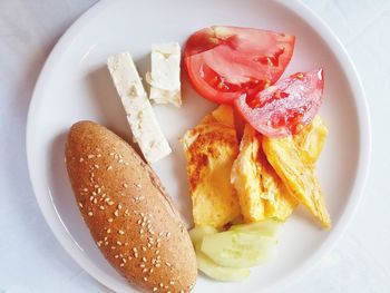 Directly above shot of food in white plate on table