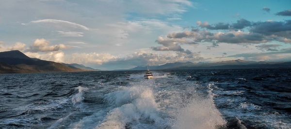 Scenic view of sea against cloudy sky