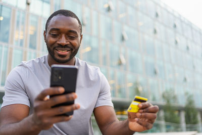 Young man using mobile phone