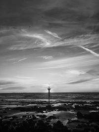 Scenic view of sea against cloudy sky