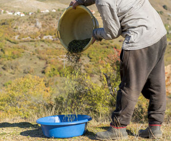 Low section of man working on farm