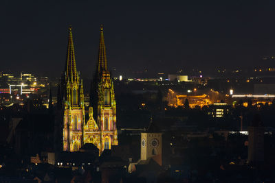 Illuminated buildings in city at night