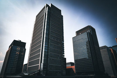 Low angle view of skyscrapers against sky